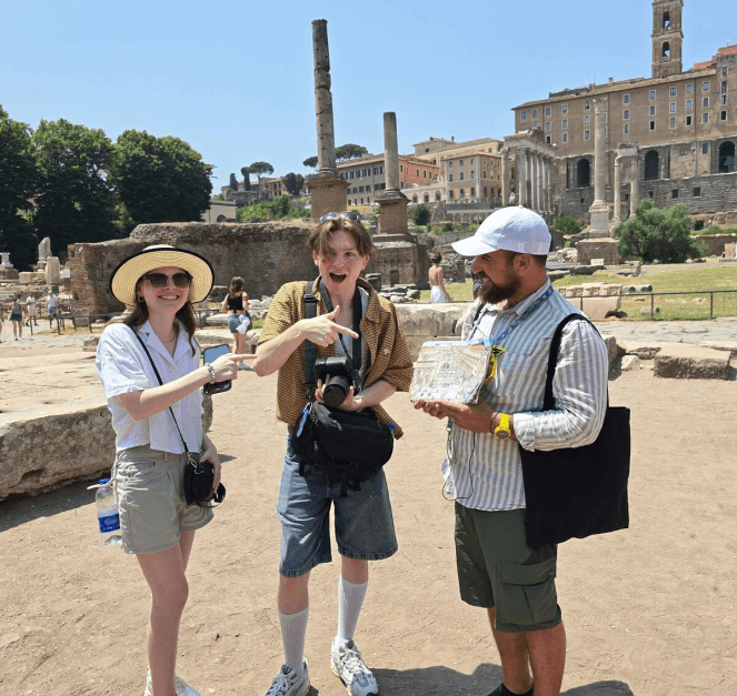 Augustine guiding tourists through historical sites